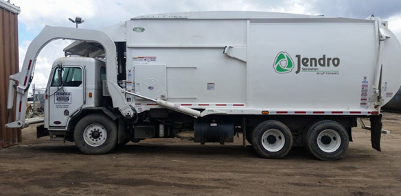 The Trash Man Photo In Front of Their Dumpster Truck